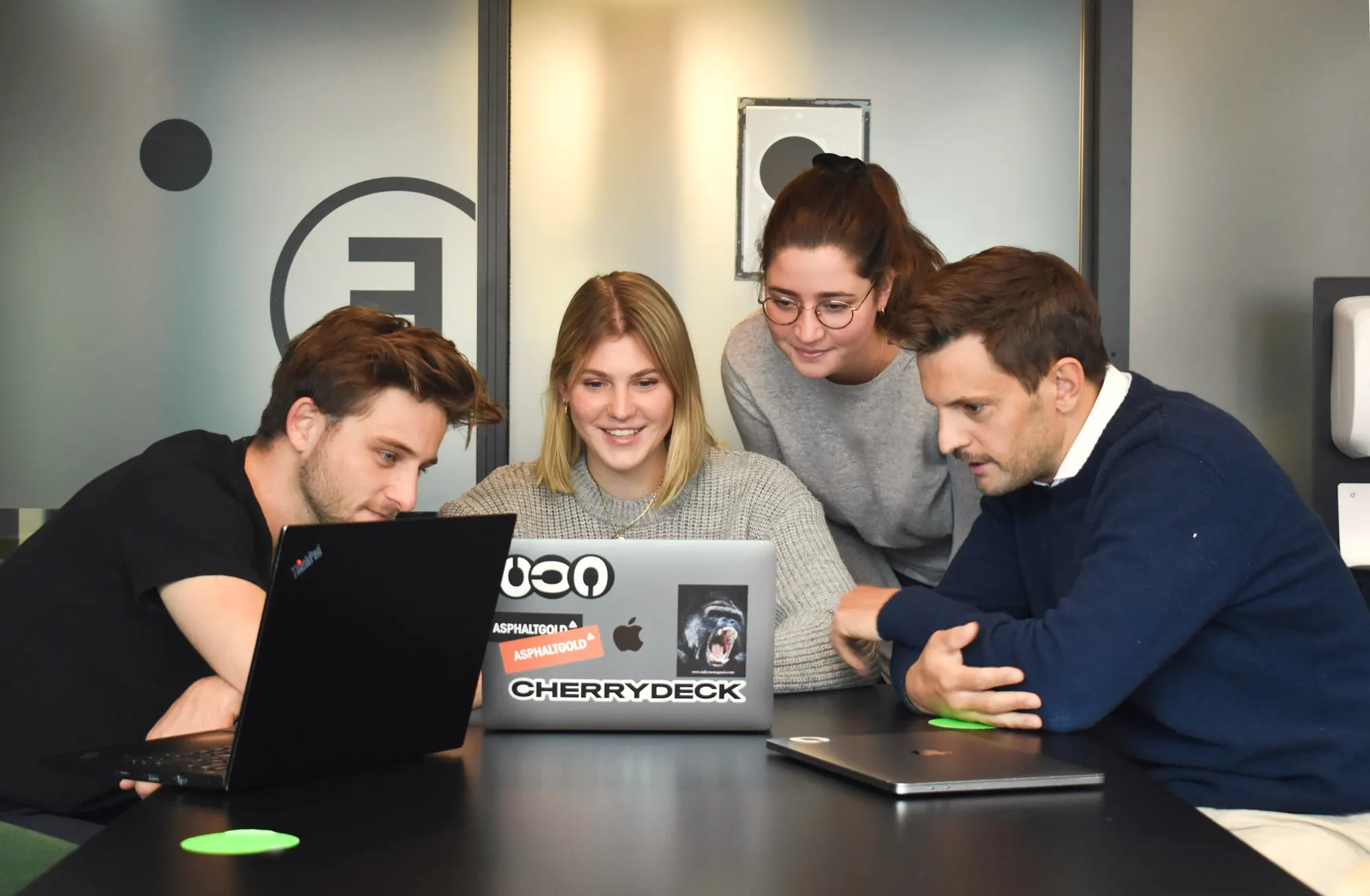 Agency team reviewing work together